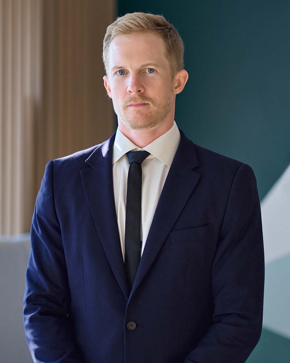 confident-young-professional-business-man-standing-Q8VC56L.jpg