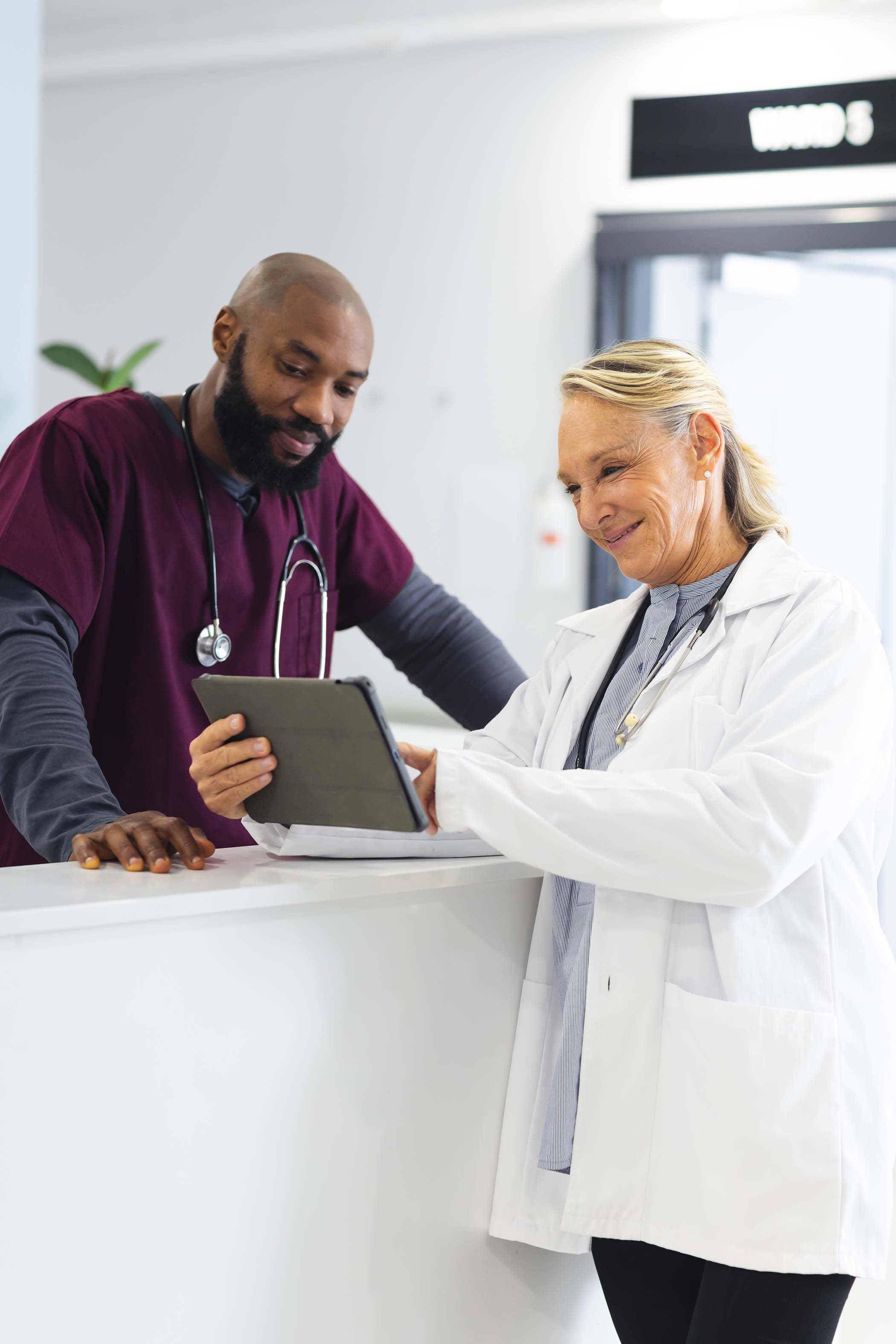 diverse-male-and-female-doctors-discussing-work-an-LWXTEEC.jpg