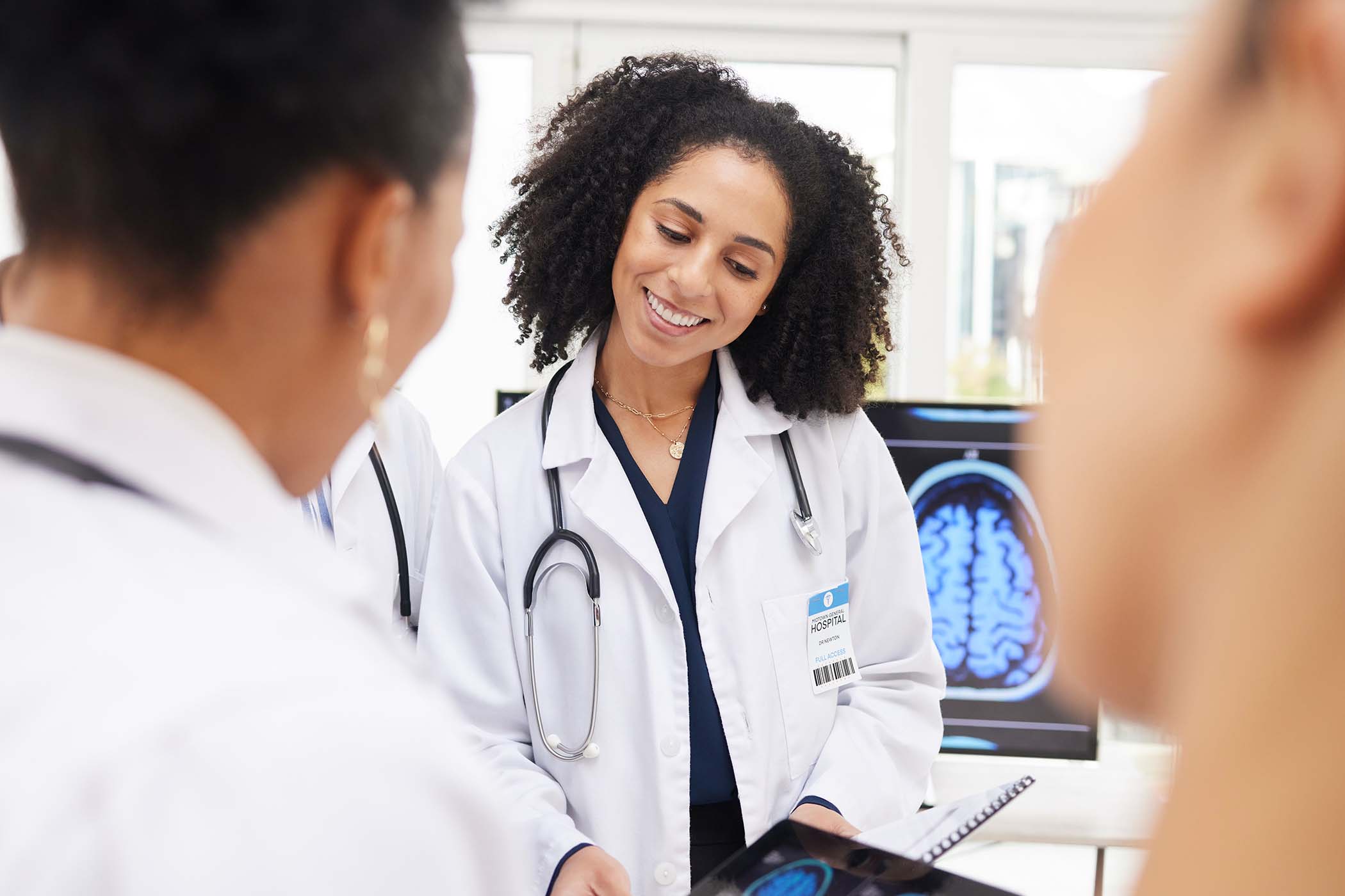 happy-woman-doctor-and-tablet-with-brain-scan-in-TDPN7DF.jpg
