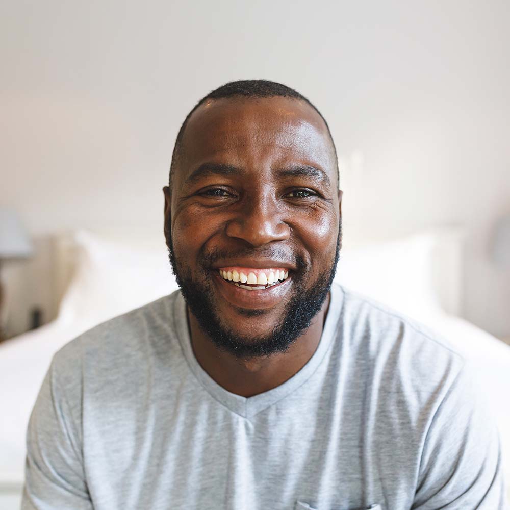 portrait-of-happy-african-american-man-looking-at-KY33EHT.jpg