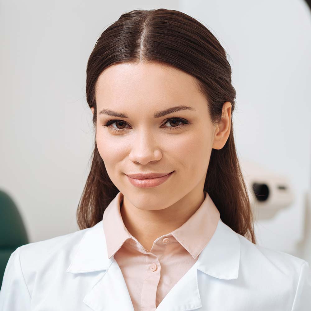 portrait-of-smiling-optician-in-white-coat-holding-ELY56CZ.jpg