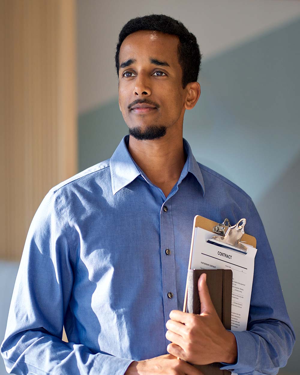 young-confident-african-business-man-standing-in-o-GTKHYWH.jpg